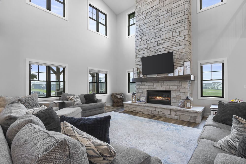 Two-story great room with stone fireplace
